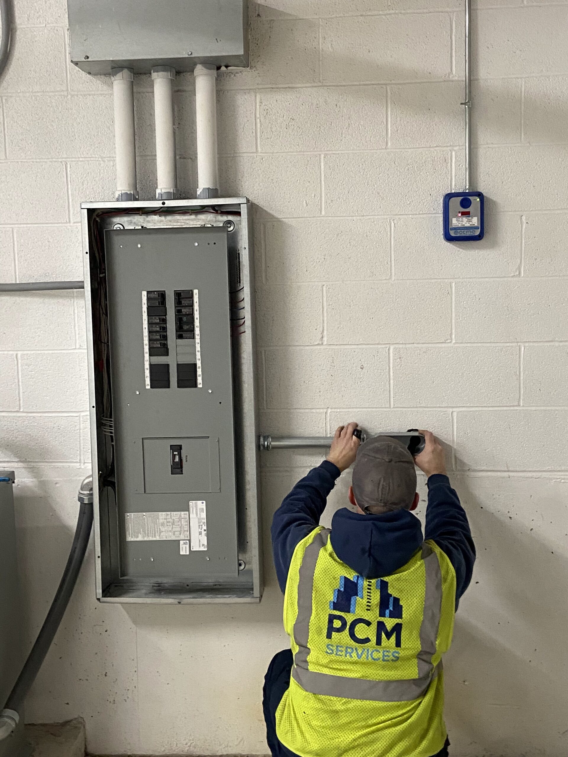 employee-repairs-electric-wiring-connected-to-fuse-box